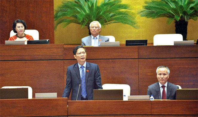 Bộ trưởng Bộ Công thương Trần Tuấn Anh giải trình tại phiên họp Ảnh: Quang Khánh