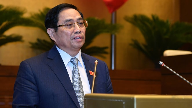 Thủ tướng Chính phủ Phạm Minh Chính trình bày Tờ trình về cơ cấu tổ chức của Chính phủ nhiệm kỳ Quốc hội Khóa XV Ảnh: Quang Khánh