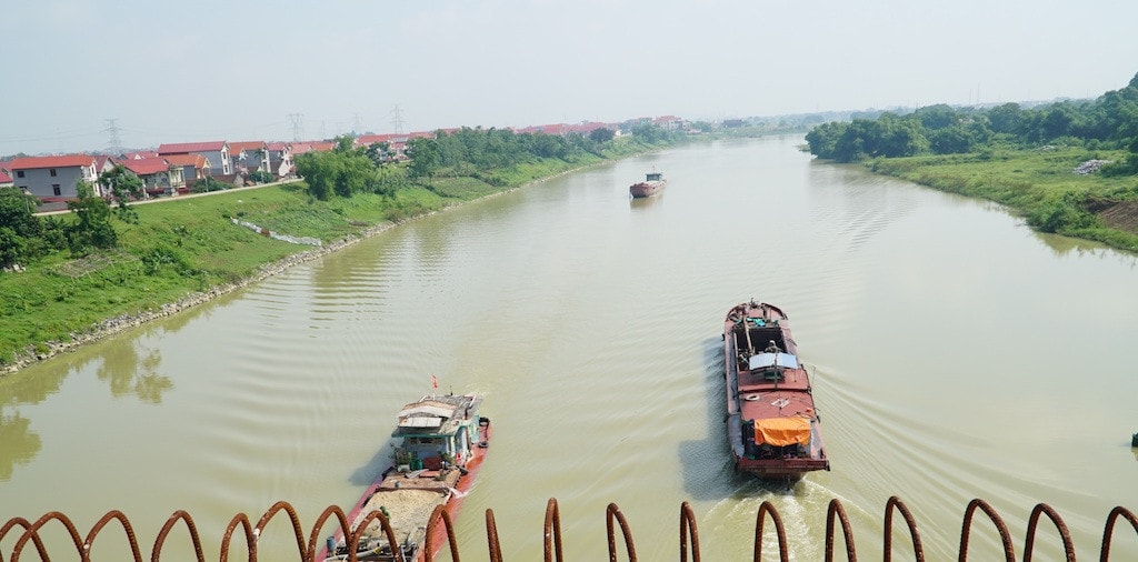 Yêu cầu Công ty Cổ phần thương mại than - khoáng sản Việt Tiến khai thác cát, sỏi lòng sông Cầu đúng quy định pháp luật -1