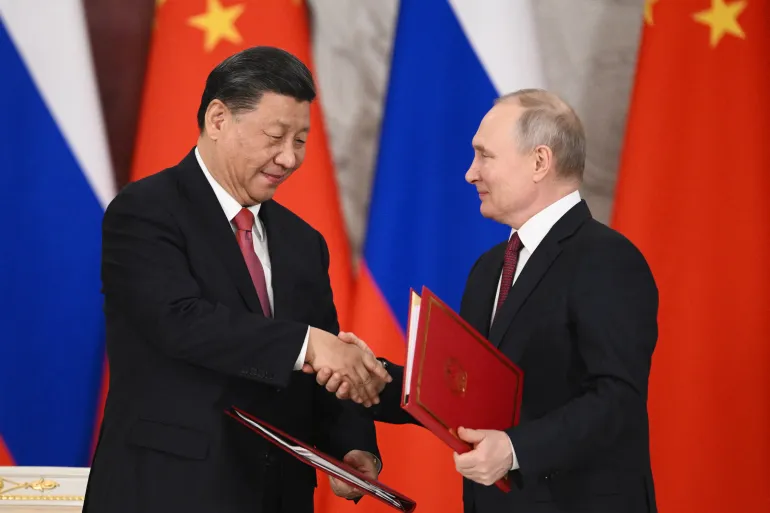 Tổng thống Nga Putin và Chủ tịch Trung Quốc Tập Cận Bình ký thỏa thuận hợp tác mới hôm 21.3 - Reuters