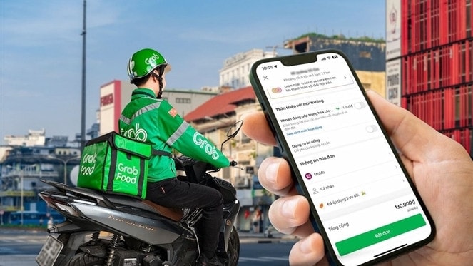 Người dùng từ nay đã có thể thanh toán bằng MoMo khi sử dụng dịch vụ của Grab. Ảnh: ITN