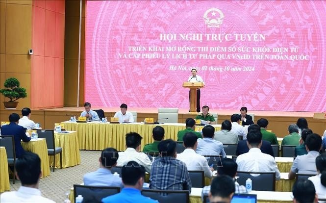 Hội nghị triển khai sổ sức khỏe điện tử và cấp phiếu lý lịch tư pháp thông qua ứng dụng VNeID. Ảnh: Dương Giang/TTXVN