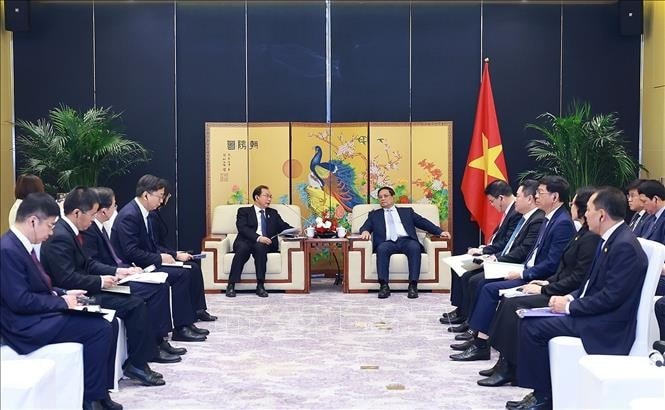 Thủ tướng Phạm Minh Chính tiếp ông Jiang Yi, Chủ tịch Tập đoàn Huadian, Trung Quốc. Ảnh: Dương Giang/TTXVN