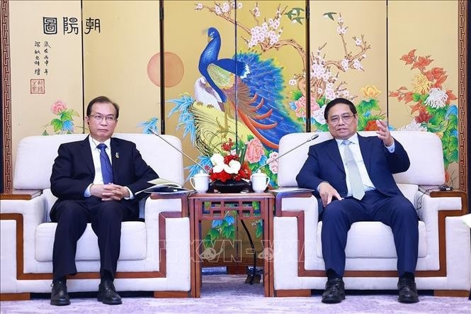 Thủ tướng Phạm Minh Chính tiếp ông Jiang Yi, Chủ tịch Tập đoàn Huadian, Trung Quốc. Ảnh: Dương Giang/TTXVN