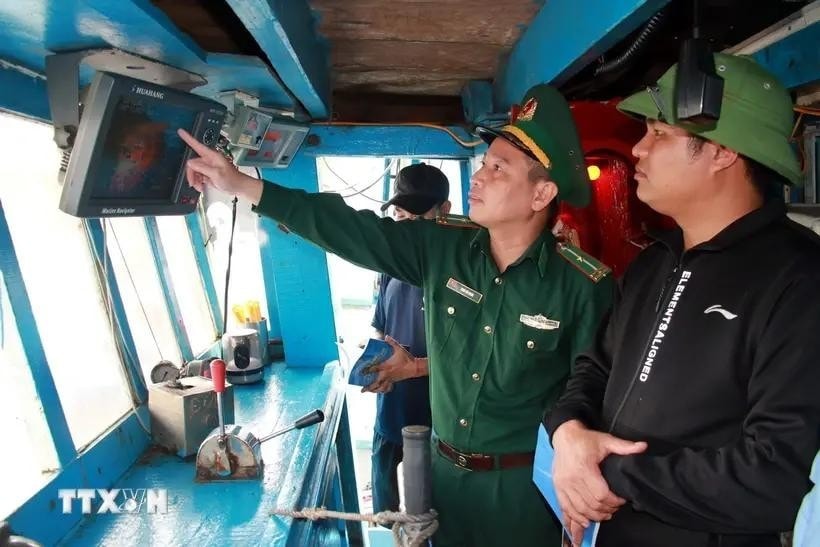 A representative from authority inspects the installation of vessel monitoring system (VMS) in a fishing vessel. (Photo: VNA) A representative from authority inspects the installation of vessel monitoring system (VMS) in a fishing vessel. (Photo: VNA)