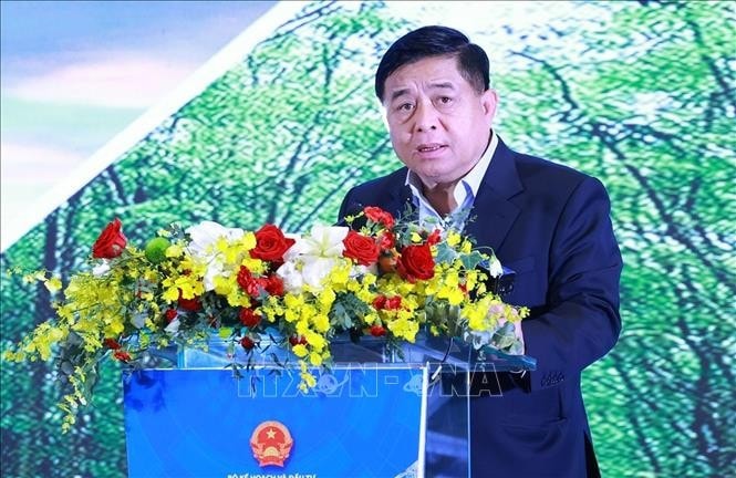 Bộ trưởng Bộ Kế hoạch và Đầu tư Nguyễn Chí Dũng báo cáo tình hình kinh tế vùng Đông Nam Bộ. Ảnh: Dương Giang/TTXVN