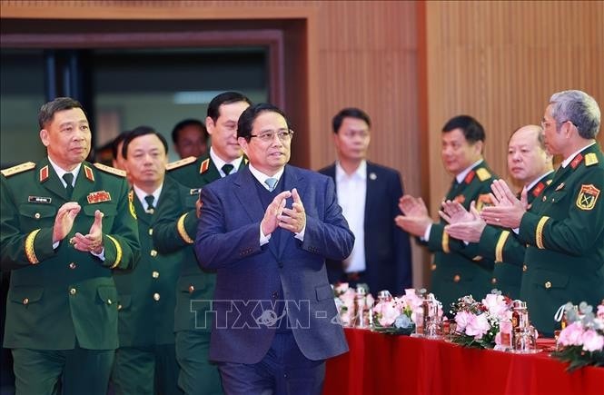 Thủ tướng Phạm Minh Chính đến thăm, chúc mừng cán bộ, giảng viên, học viên Học viện Quốc phòng. Ảnh: Dương Giang/TTXVN