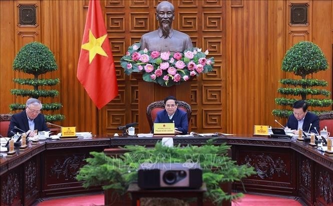 Prime Minister Pham Minh Chinh (C) chairs the fourth meeting of the government steering committee to review the implementation of Resolution No. 18-NQ/TW on December 17. (Photo: VNA) Prime Minister Pham Minh Chinh (C) chairs the fourth meeting of the government steering committee to review the implementation of Resolution No. 18-NQ/TW on December 17. (Photo: VNA)