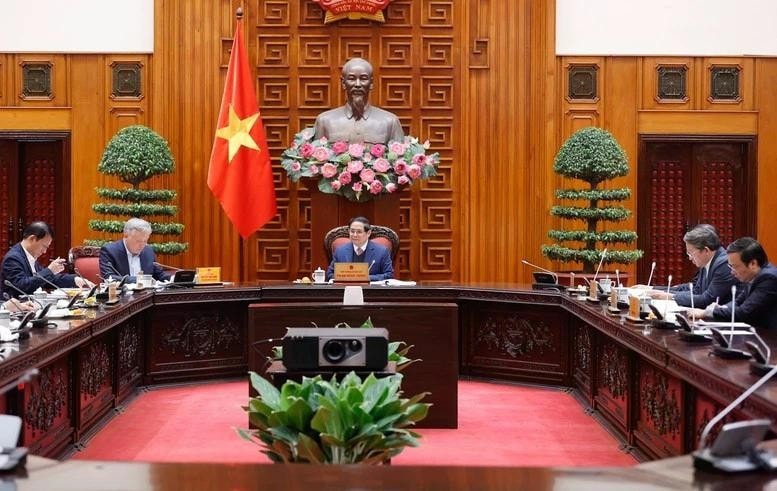 Prime Minister Pham Minh Chinh chaired a working session with the Ministry of National Defence and the Ministry of Public Security (MPS) in Hanoi on December 30 to review their apparatus reorganisation. Photo: VGP img-5718.jpg