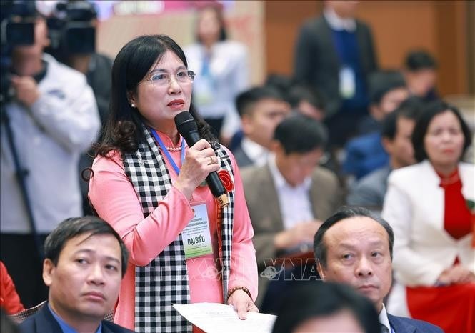Bà Hoàng Thị Gái, nông dân thành phố Hải Phòng phát biểu tại buổi đối thoại. Ảnh: Dương Giang/TTXVN