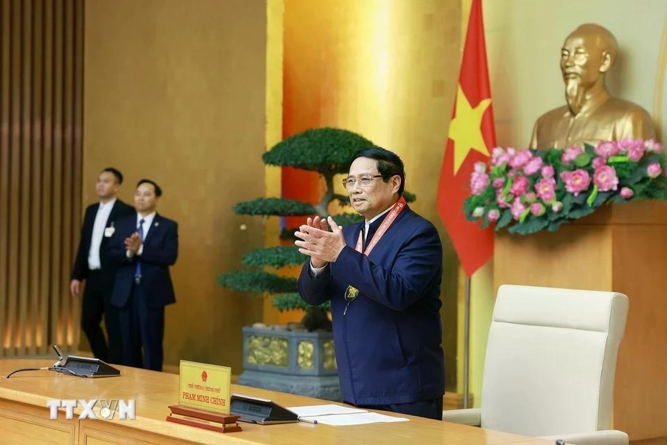 Thủ tướng Phạm Minh Chính chúc mừng Đội tuyển bóng đá nam quốc gia Việt Nam. Ảnh: Dương Giang/TTXVN