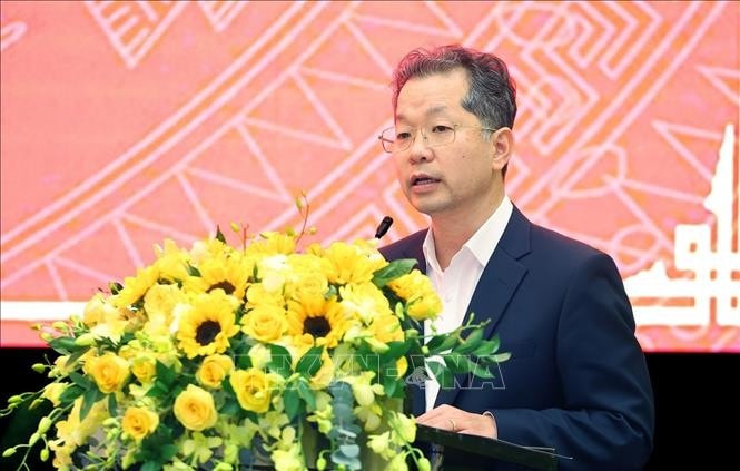 Bí thư Thành uỷ Đà Nẵng Nguyễn Văn Quảng báo cáo tình hình kinh tế-xã hội của thành phố. Ảnh: Dương Giang/TTXVN
