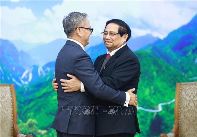 Thủ tướng Phạm Minh Chính tiếp Bộ trưởng Ngoại giao Lào Thongsavanh Phomvihane. Ảnh: Dương Giang/TTXVN