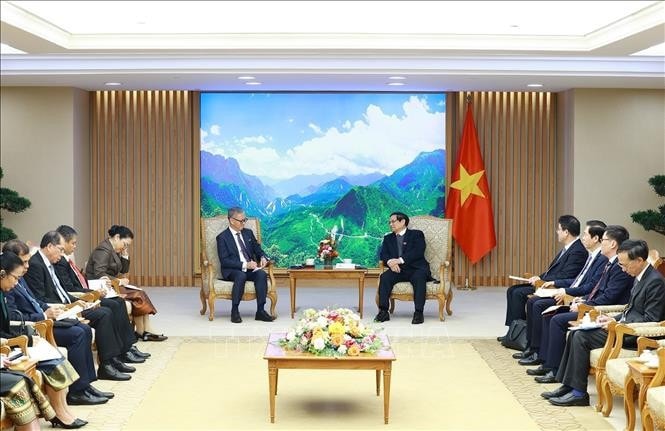 Thủ tướng Phạm Minh Chính tiếp Bộ trưởng Ngoại giao Lào Thongsavanh Phomvihane. Ảnh: Dương Giang/TTXVN