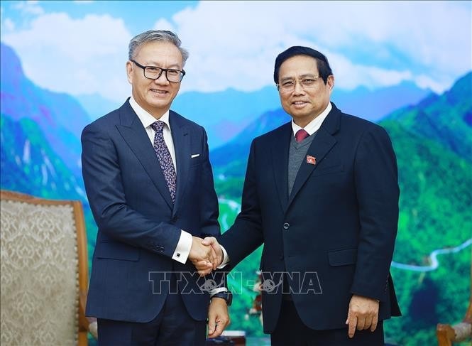 Thủ tướng Phạm Minh Chính tiếp Bộ trưởng Ngoại giao Lào Thongsavanh Phomvihane. Ảnh: Dương Giang/TTXVN