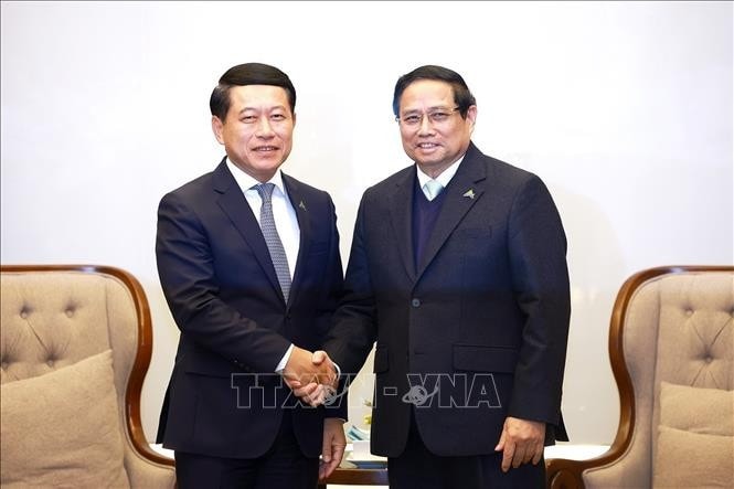 Thủ tướng Phạm Minh Chính tiếp Phó Thủ tướng Lào Saleumxay Kommasith. Ảnh: Dương Giang/TTXVN