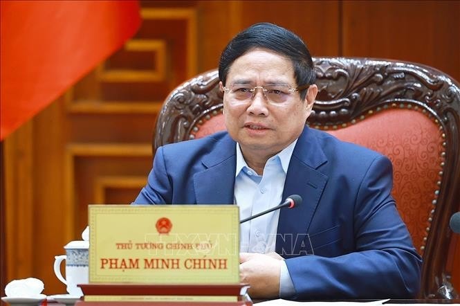 Thủ tướng Phạm Minh Chính chủ trì cuộc họp về mức áp thuế mới của Hoa Kỳ đối với hàng hoá nhập khẩu từ Việt Nam. Ảnh: Dương Giang/TTXVN
