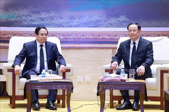 Thủ tướng Phạm Minh Chính gặp Thủ tướng Lào Sonexay Siphandone. Ảnh: Dương Giang/TTXVN