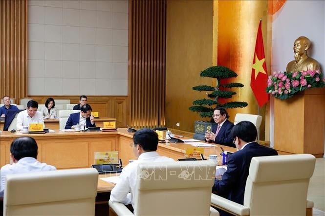 Thủ tướng Phạm Minh Chính chủ trì cuộc họp về cập nhật tình hình và giải pháp ứng phó với chính sách thuế quan của Hoa Kỳ. Ảnh: Dương Giang/TTXVN