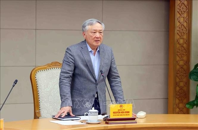 Phó Thủ tướng Thường trực Nguyễn Hòa Bình vừa ký Quyết định phê duyệt Đề án sắp xếp, tổ chức lại đơn vị hành chính các cấp và xây dựng mô hình tổ chức chính quyền địa phương 2 cấp. Ảnh tư liệu: Phạm Kiên/TTXVN