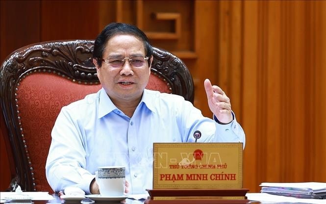 Thủ tướng Phạm Minh Chính chủ trì họp Thường trực Chính phủ với các bộ, ngành và Đoàn đàm phán Chính phủ về các vấn đề thương mại với Hoa Kỳ. Ảnh: Dương Giang/TTXVN