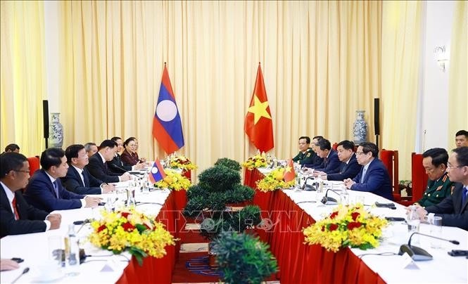Thủ tướng Phạm Minh Chính hội kiến Tổng Bí thư, Chủ tịch nước Lào Thongloun Sisoulith. Ảnh: Dương Giang/TTXVN