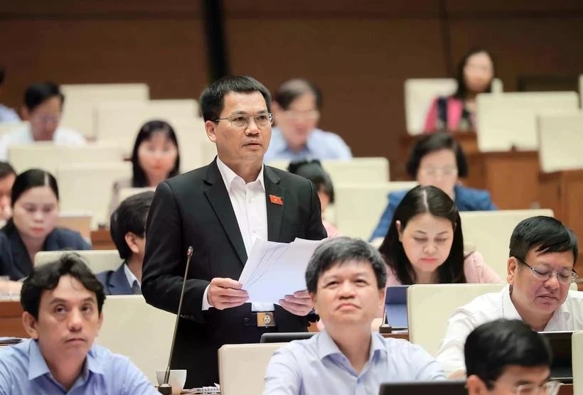 Deputies discuss draft laws presented to the National Assembly during its ongoing 9th session. (Photo: VNA)