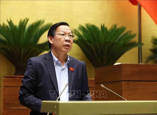 Phan Van Mai, Chairman of the National Assembly’s Committee for Economic and Financial Affairs, delivers a report presenting explanations, feedback, and revisions to the amended draft Law on Corporate Income Tax. (Photo: VNA)