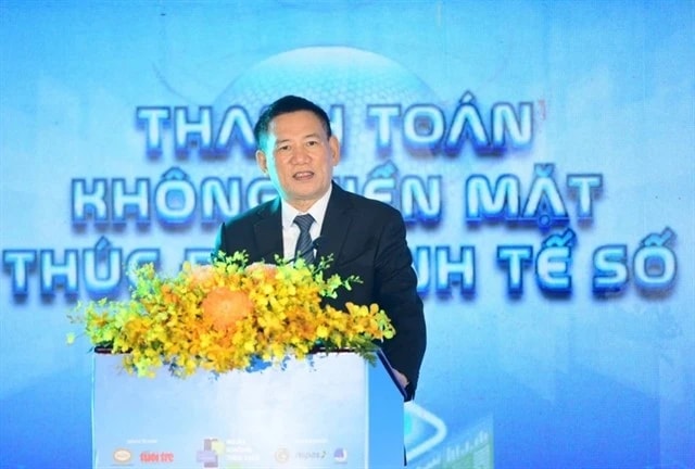 Deputy Prime Minister Ho Duc Phoc speaks on Saturday at a seminar held as part of the annual Cashless Day 2025 event in HCM City (Photo: VNA)