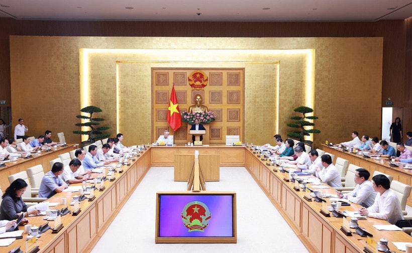 Prime Minister Pham Minh Chinh addresses a conference reviewing one month of running the two-tier local administration system on July 28. (Photo: VNA)