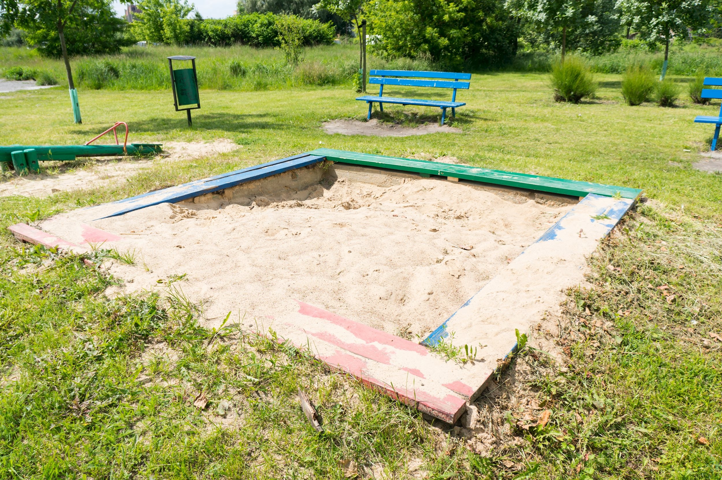 sandbox-with-white-sand-grassy-playground.jpg
