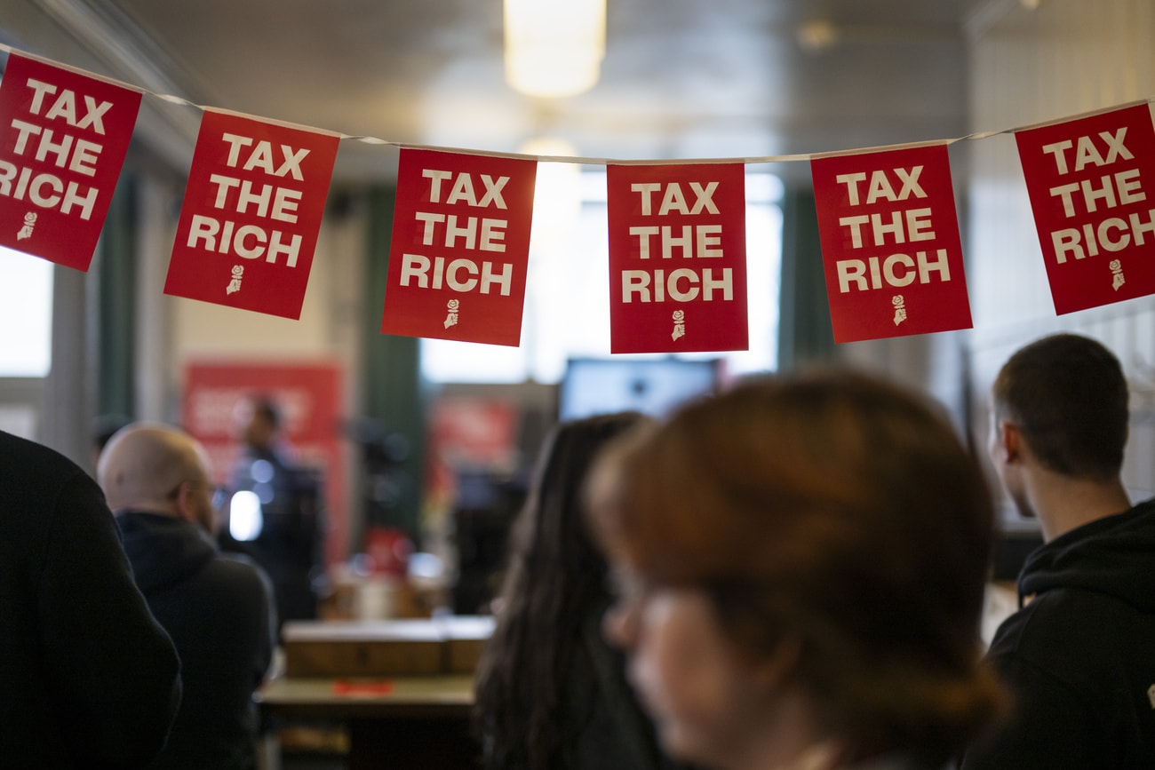 Activists and media reps at voting event of the Young Socialists for their initiative to tax the super rich on their inheritance.