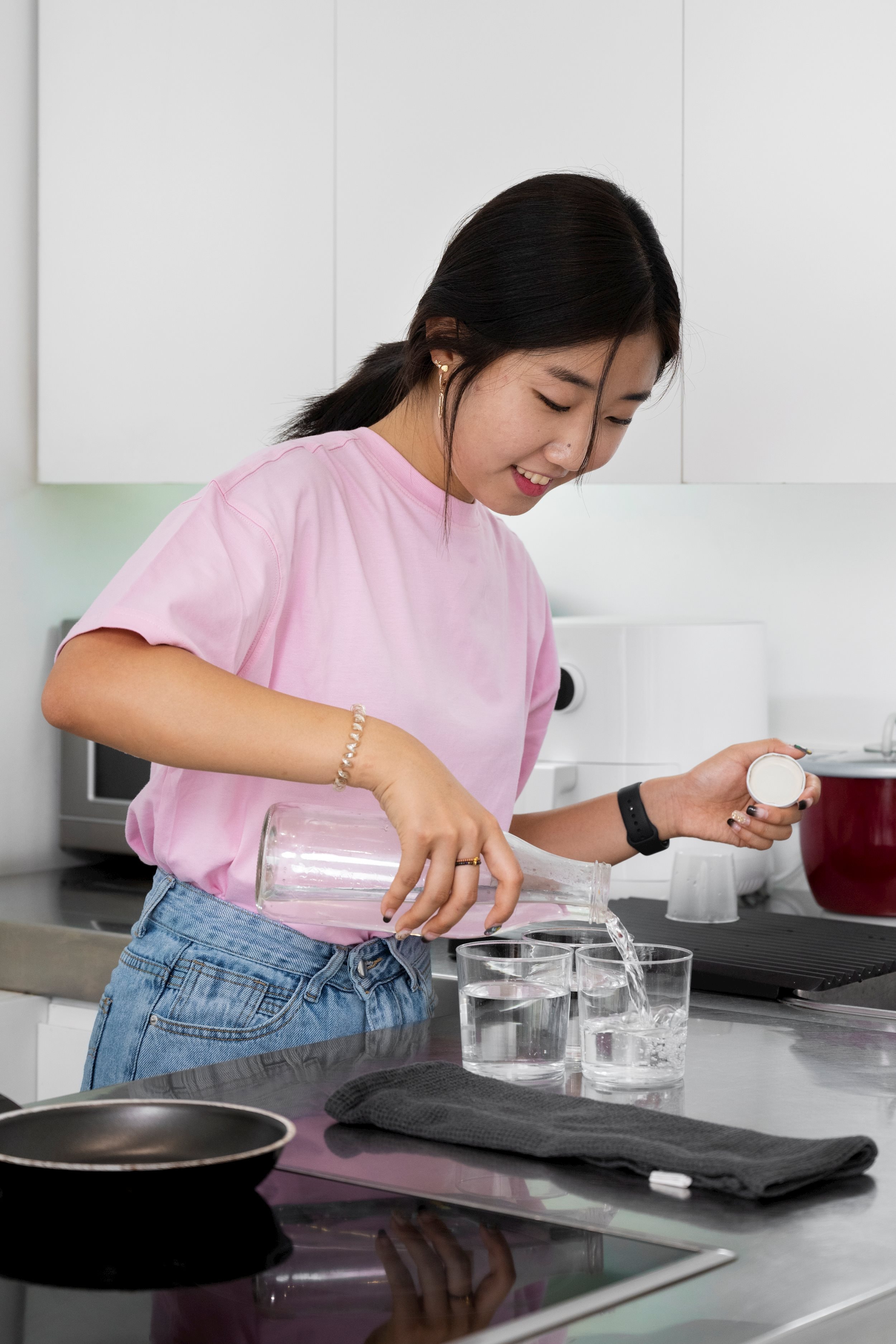 side-view-smiley-girl-pouring-water.jpg