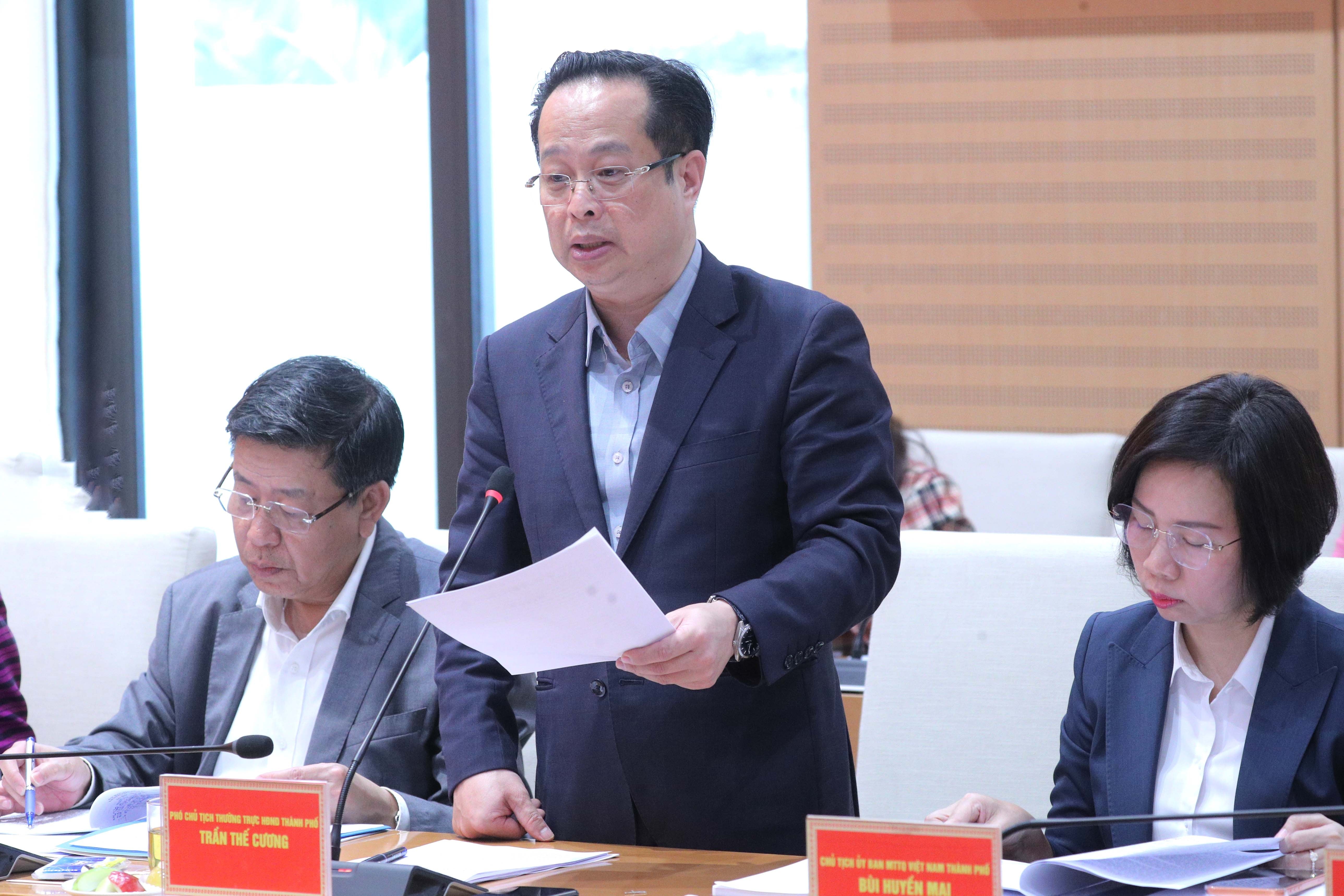 Mr. Tran The Cuong, Standing Vice Chairman of the Hanoi People's Council, presented the report.