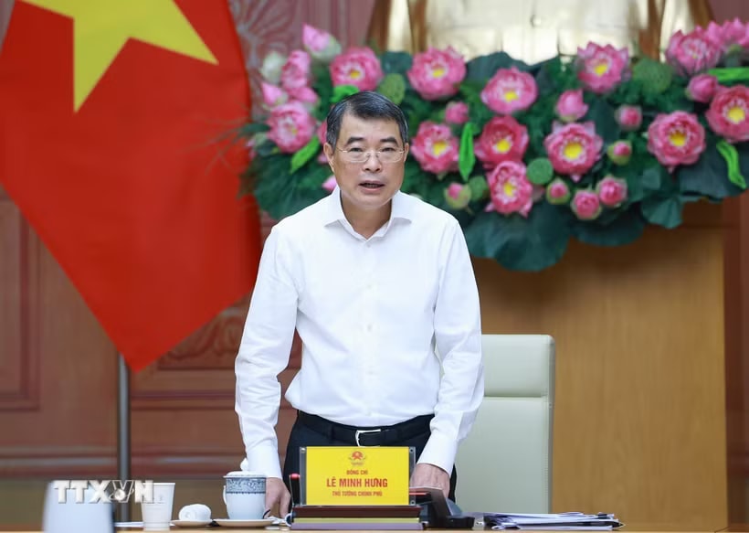 Thủ tướng Lê Minh Hưng chủ trì buổi làm việc với lãnh đạo Bộ Công Thương và các bộ, ngành về tháo gỡ khó khăn, thúc đẩy sản xuất kinh doanh. (Ảnh: Dương Giang/TTXVN)