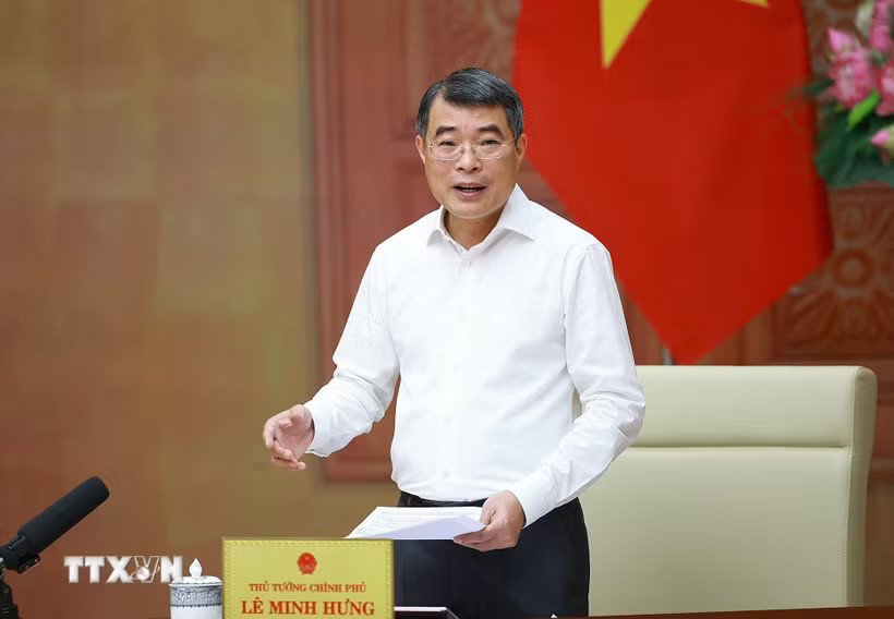 Thủ tướng Lê Minh Hưng làm việc với lãnh đạo Bộ Xây dựng. (Ảnh: Dương Giang/TTXVN)