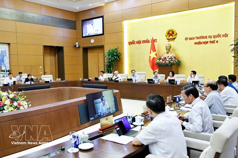 Deputies attend the fourth session of the National Assembly Standing Committee in Hanoi on July 15. (Photo: VNA)