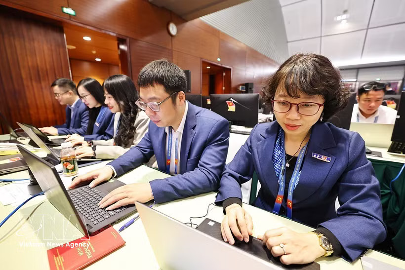 Vietnam News Agency reporters covering the 14th National Party Congress (Photo: VNA)