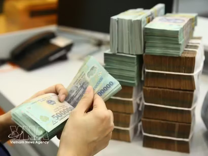 The State Bank of Vietnam sets the daily reference exchange rate at 25,594 VND/USD on September 9. (Photo: VNA)
