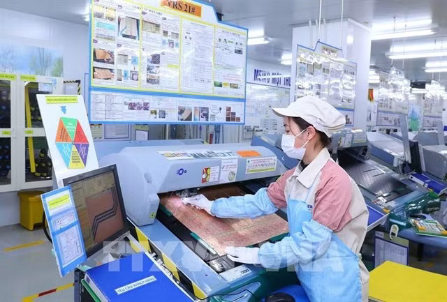 Electronic components are produced at a factory in Hanoi. (Photo: VNA)