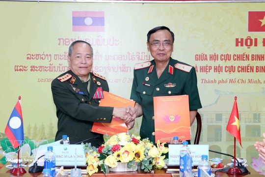 Ho Chi Minh City, Lao locality share experience in veterans’ association work