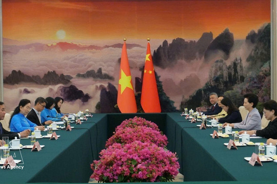 Vietnamese, Chinese women step up exchanges, cooperation